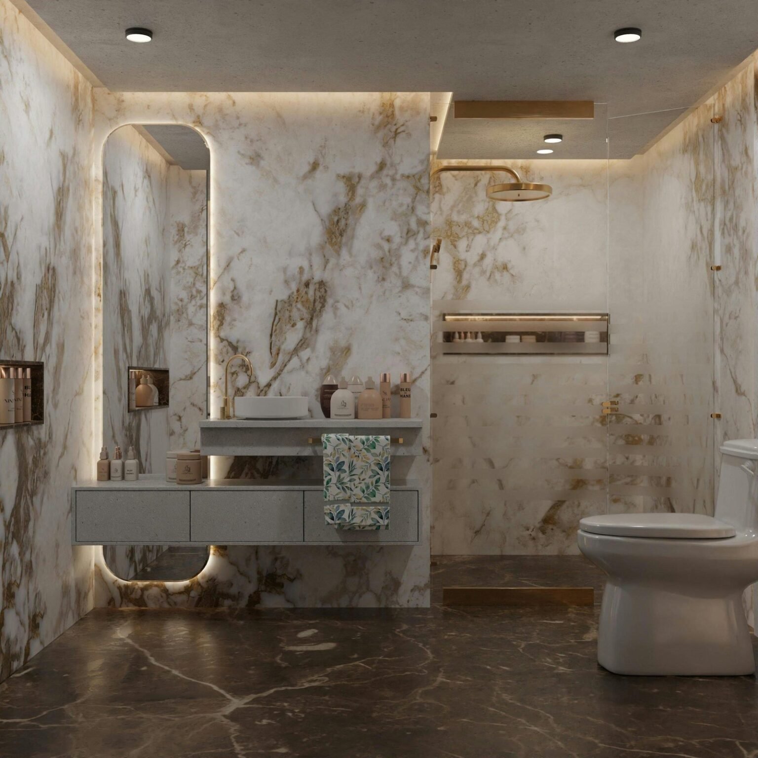 Stock construcción 61 – Girona Baño con paredes y suelo de mármol de vetas doradas, mueble suspendido y espejo iluminado